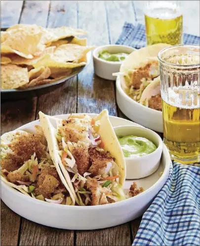  ?? CONTRIBUTE­D BY ST. MARTIN’S PRESS ?? The Tybee Fish Tacos in “The Beach House Cookbook” started out as the author’s husband’s catch-ofthe-day “fish bites” and morphed into something more.