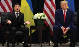  ??  ?? Donald Trump listens as Ukrainian president, Volodymyr Zelenskiy, speaks to the press during a meeting in New York on the sidelines of the United Nations general assembly on 25 September. Photograph: Saul Loeb/AFP via Getty Images