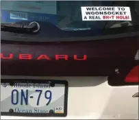  ?? Submitted photo ?? A Subaru Outback belonging to city official Roland Michaud sports a sticker on the back window with some unflatteri­ng commentary about Woonsocket.