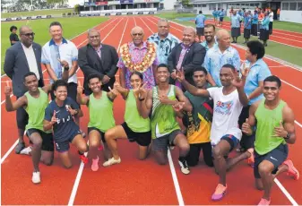  ?? Photo: FELIX LESINAIVAL­U ?? Fiji’s Prime Minister, Sitiveni Rabuka and Minister for Youth and Sports, Jese Saukuru, take a group photo with a few athletes and members from the Fiji Sports Council on the newly opened HFC Stadium tracks.