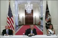  ?? ALEX BRANDON - THE ASSOCIATED PRESS ?? President Donald Trump, Vice President Mike Pence, left, and first lady Melania Trump, attend a “National Dialogue on Safely Reopening America’s Schools,” event in the East Room of the White House, Tuesday, July 7, in Washington.