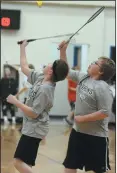  ?? NEWS PHOTO SEAN ROONEY ?? Teammates Logan Maser Heidrick and Nathan Lehr of Parkside school both go for the shot during doubles badminton play at the Colts/Dawgs Mega Tournament Friday at Notre Dame Academy.