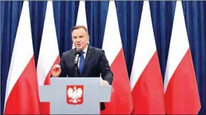  ?? JANEK SKARZYNSKI/AFP ?? Poland’s President Andrzej Duda gives a press conference on Tuesday in Warsaw to announces that he will sign into law a controvers­ial Holocaust bill which has sparked tensions with Israel, the US and Ukraine.