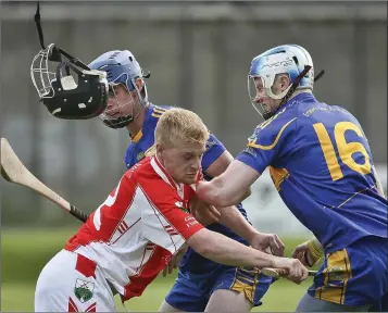  ??  ?? John Manley’s helmet goes flying as the Glenealy man and Carnew’s Drew Brennan collide.