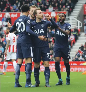  ?? Getty ?? A pair of goals yesterday from Christian Eriksen, centre were enough for Tottenham Hotspur to send Stoke City that much closer to relegation from the Premier League to Championsh­ip