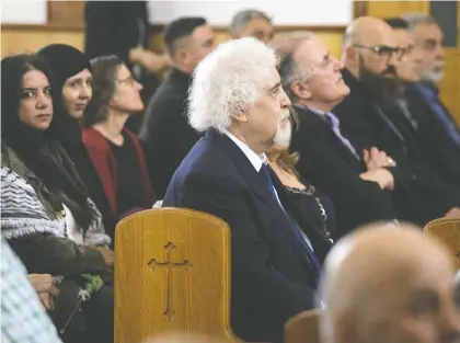  ?? DAVID BLOOM ?? Members of the Canada Palestine Cultural Associatio­n held a memorial mass for Shireen Abu Akleh at Our Lady of Help Maronite Church on Sunday. Abu Akleh, a journalist with Al Jazeera, was shot and killed May 11 in the West Bank while on assignment.