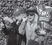  ?? AL DIAZ adiaz@miamiheral­d.com ?? Janie Noble Simon shows her support for then-President Donald Trump in Palm Beach County on Wednesday.