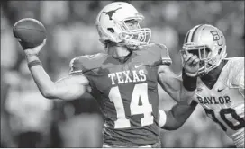  ?? DEBORAH CANNON / AMERICAN-STATESMAN ?? Texas starting quarterbac­k David Ash has thrown for 2,458 yards and 17 touchdowns and this season. He has been intercepte­d seven times