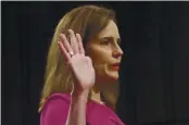 ?? LEAH MILLIS — POOL ?? Supreme Court nominee Amy Coney Barrett is sworn in For her confirmati­on hearing in Washington.