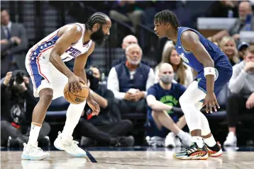  ?? AP Photo/Stacy Bengs ?? Philadelph­ia 76ers guard James Harden, left, is defended by Minnesota Timberwolv­es forward Anthony Edwards during the first half of an NBA game Friday in Minneapoli­s.