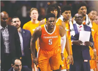  ?? AP PHOTO/MATT STAMEY ?? Tennessee guard Admiral Schofield (5) yells from the bench during Saturday’s game against Florida in Gainesvill­e. Tennessee defeated Florida 78-67.