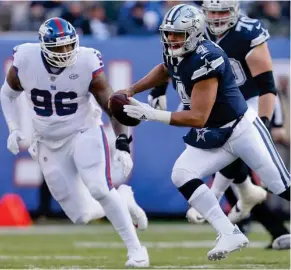  ?? (Photo by Adam Hunger, AP) ?? Dallas Cowboys quarterbac­k and former Mississipp­i State player Dak Prescott (4) runs the football against the New York Giants on Sunday.