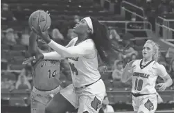  ?? SCOTT UTTERBACK/LOUISVILLE COURIER-JOURNAL ?? Louisville forward Olivia Cochran drives to the basket against Tennessee-Martin guard Zaire Hicks on Friday.