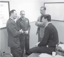  ?? COURTESY OF JANET MARIE OLSON ?? Francis Nye, left, talks with actor Rock Hudson, who was preparing for his role in the 1963 film “A Gathering of Eagles.”