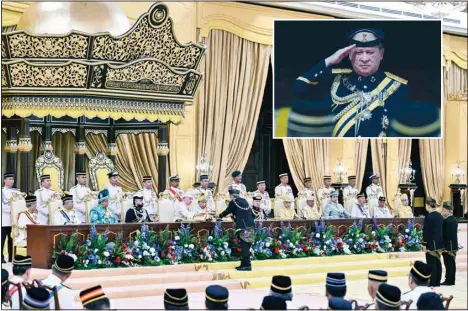  ?? ?? Sultan of Johor, Sultan Ibrahim Iskandar, center, sits during the oath taking ceremony as the 17th King of Malaysia at the National Palace in Kuala Lumpur, Malaysia, on Jan 31. Inset: Sultan Ibrahim salutes the guard of honor at National Palace in Kuala Lumpur, Malaysia on Wednesday. (AP)