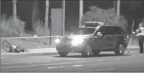  ?? ABC-15.com via AP ?? Accident: This still image taken from video provided by ABC-15, shows investigat­ors at the scene of a fatal accident involving a self driving Uber car on the street in Tempe, Arizona Police in the city of Tempe said Monday that the vehicle was in...