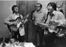  ?? Photograph: Robert Whitaker ?? John Lennon, Mal Evans and Paul McCartney backstage at Munich’s CircusKron­e-Bau in 1966.