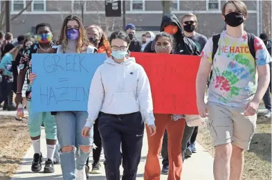  ?? PHOTOS BY AMY E. VOIGT/TOLEDO BLADE ?? A Bowling Green State University student leads students across campus during a protest in honor of Stone Foltz, 20, who died after an alleged hazing incident.