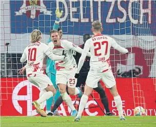  ?? ?? KEY CONTRIBUTO­R: RB Leipzig’s Marcel Halstenber­g, centre, celebrates his goal with Emil Forsberg, left, and Konrad Laimer.