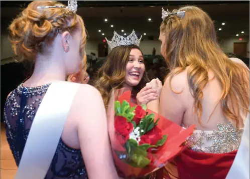  ?? RECORDER PHOTOS BY CHIEKO HARA ?? Newly crowned Veteran’s Homecoming Queen Brianna Torres, center, celebrates with her fellow contestant­s Calista Spohn, senior princess, left, and Shelby Whinery, third attendant, after the 72nd annual Veteran’s Homecoming Queen and Miss Portervill­e...