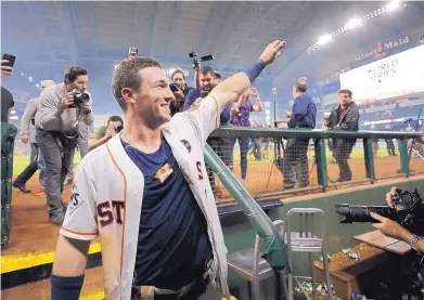  ?? DAVID J. PHILLIP/ASSOCIATED PRESS ?? Albuquerqu­e Academy grad Alex Bregman celebrates after his game-winning single for the Houston Astros in the 10th inning of Game 5 of the World Series. Bregman has been a major contributo­r this postseason.