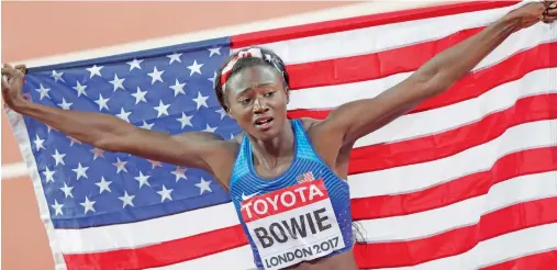  ?? AFP ?? American Tori Bowie came up with a sensationa­l run to claim the 100m gold by narrowly beating Marie-Josee Ta Lou. —
