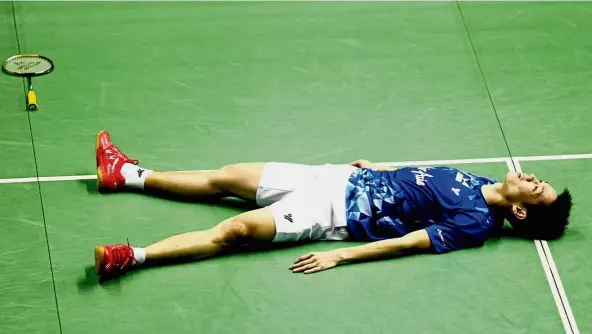  ?? — S.S. Kanesan / The Star ?? What a day: Liew Daren lying in disbelief after defeating Suppanyu Avihingsan­on in the quarter-finals of the Perodua Malaysian Masters at the Axiata Arena yesterday.