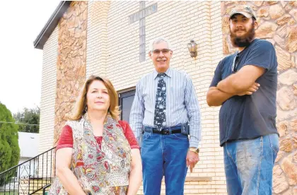 ?? COURTESY OF RUSSEL SKILES/LAMESA PRESS-REPORTER ?? Tammy Gibbs, Lee Lennon and Tommy Barbour pose in front of First Church of the Nazarene in Lamesa, Texas, on Sept. 16. Lennon was the pastor of the Church of the Nazarene Church in Lamesa, where Amos Jacob Arroyo attended services. Gibbs worked closely with Arroyo at a church mission ministry and thrift store, and Barbour, 23, is a church member who worked remodeling and contractin­g jobs with Arroyo.