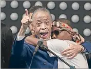  ?? Jeff Chiu Associated Press ?? THE REV. Al Sharpton, left, and Stevante Clark hug at Thursday’s funeral for Clark’s brother Stephon.