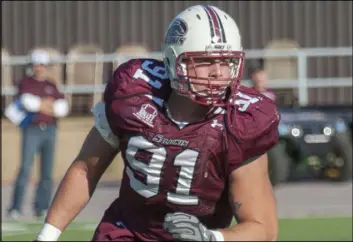  ?? The Associated Press ?? Noblesvill­e West Middle School science teacher Jason Seaman, shown while playing football for Southern Illinois University, subdued a student armed with two handguns who opened fire inside his classroom Friday in Noblesvill­e, Ind.