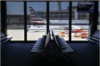  ?? Bloomberg photo by Patrick T. Fallon ?? ■ Empty seats are seen in the American Airlines terminal June 13 at O’Hare Internatio­nal Airport in Chicago.