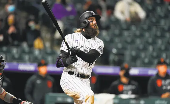  ?? David Zalubowski / Associated Press ?? Colorado’s Charlie Blackmon’s threerun, walkoff homer off Camilo Doval kept the Giants from sweeping the doublehead­er.