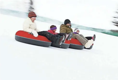  ?? ERIC WUENNENBER­G AND PERFORMANC­E PHOTO LLC ?? Minocqua Winter Park features a 400-foot lift-assisted tubing hill.