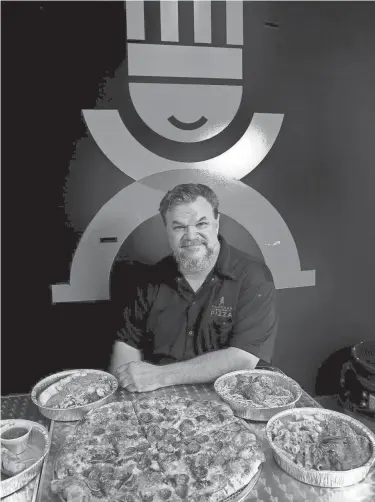  ?? FRED SQUILLANTE/COLUMBUS DISPATCH ?? Rich Rores has opened Sandman Pizza after closing his former restaurant, Sandman Gourmet, several months because of COVID-19.
