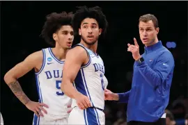  ?? MARY ALTAFFER — THE ASSOCIATED PRESS ?? Duke head coach Jon Scheyer, right, gives guard Tyrese Proctor and guard Jared Mccain direction during the second half of a second-round college basketball game against James Madison in the NCAA Tournament, Sunday, March 24, 2024, in New York. Duke won 93-55.