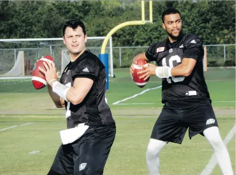  ?? MURRAY McCORMICK ?? Saskatchew­an Roughrider­s quarterbac­ks Zach Collaros, left, and Brandon Bridge are in the most obvious battle in the CFL to win a No. 1 starter’s job heading into training camp, and on the eve of the team’s regular season opener, coach Chris Jones still...