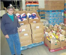  ?? KRIS DUBE/SPECIAL TO THE REVIEW ?? Wray Robbins, a 91-year-old veteran from Fort Erie, is behind a donation of 210 turkeys to needy families in the community. He was at Jesse and Kelly's No Frills on Tuesday for the annual tradition that has been taking place for 20 years.