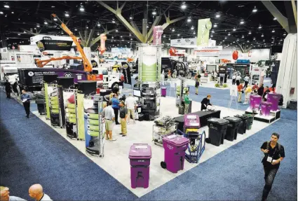  ?? JASON OGULNIK/ LAS VEGAS REVIEW-JOURNAL ?? Waste Expo attendees walk the exhibition floor Wednesday at the Las Vegas Convention Center. The trade show ends today.