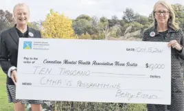  ?? CONTRIBUTE­D ?? Betsy Eisner (left) and friend Janice Barnhill hold the oversized check representi­ng the donation to the Canadian Mental Health Associatio­n Nova Scotia Division through Eisner’s ‘Vaccinated’ pins campaign.