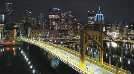  ?? FILE — THE ASSOCIATED PRESS ?? The newly refurbishe­d Rachel Carson Bridge is seen over the Allegheny River in downtown Pittsburgh. President Joe Biden wants $2 trillion to reengineer America’s infrastruc­ture and expects the nation’s corporatio­ns to pay for it.