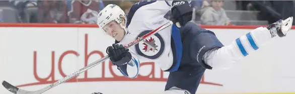  ?? DAVID ZALUBOWSKI/ THE CANADIAN PRESS/AP ?? With a deadly one-timer as his primary weapon of choice, Winnipeg Jets rookie forward Patrik Laine has wasted little time making a big splash in the NHL. With 27 goals already, the Finnish standout is on pace for at least 40 goals and could contend to...