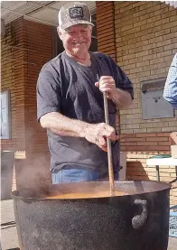  ?? Staff photo by Neil Abeles ?? ■ That’s a real look of pride on Don Neal’s face. He’s convinced he’s one of the best chicken-pot stirrers around.