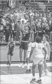  ?? Tim Godbee ?? Calhoun junior Makadan Griffin reaches for a layup against Cartersvil­le Wednesday night in the Jackets' Region 7-5A 71-65 loss to the Purple Hurricanes.