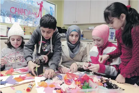  ?? NICK PROCAYLO/PNG ?? Syrian refugee children are seen at a family welcoming centre run by the Mount Pleasant Family Care Society in Vancouver.