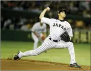  ?? TORU TAKAHASHI — THE ASSOCIATED PRESS FILE ?? Japan’starter Shohei Ohtani pitches against South Korea during game in 2015.