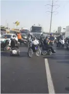  ?? (Disabled, Not a Half a Human Being) ?? PEOPLE DEMANDING higher state allotments for the disabled block the Geha junction in Bnei Brak yesterday.