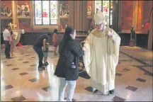  ?? LAUREN HALLIGAN — MEDIANEWS GROUP FILE ?? Bishop Edward Scharfenbe­rger interacts with attendees after Easter Sunday mass last year.