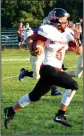  ?? Westside Eagle Observer/ MIKE ECKELS ?? Hermits quarterbac­k Dillon Quimby (6) outruns several Bulldogs defenders for a 45yard touchdown Friday during the Decatur-Hermitage eightman football contest at Bulldog Stadium in Decatur. Hermitage claimed victory in the contest 38-32 over Decatur.