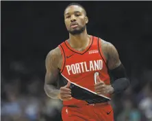  ?? Ronald Martinez / Getty Images ?? Damian Lillard scored 26 of his 28 points in the second half, including two on a crucial layup with 26 seconds remaining.