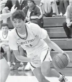  ?? KEN GROSSE ?? Torrey Pines senior Brandon Angel (shown in a game last season) scored 21 points to help lead the Falcons to an Open Division win.